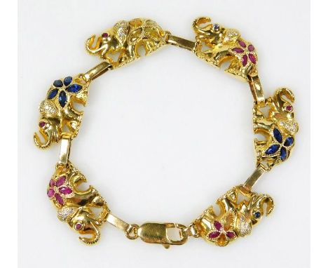 An open backed cast elephant design bracelet, comprising of 24 round brilliant cut diamonds weighing approximately 0.12ct, th