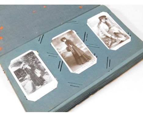 An album of early 20thC and later postcards, figure cards, portrait cards, The Bad Girl of The Family, other film and movie s