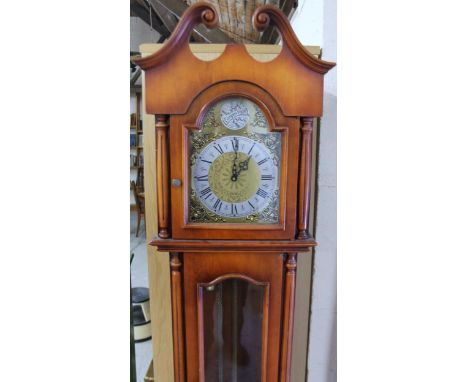 A Tempus Fugit longcase clock, with Roman numeral brass finish dial and quarterly charm, 202cm high.