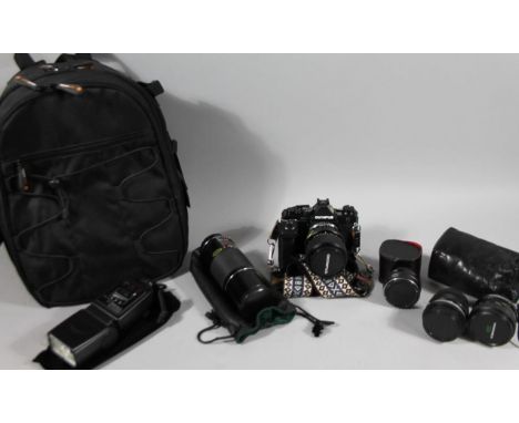 A camera bag, containing various camera equipment, Olympus camera OM2 with 35-70mm lens, converter, auto OPTOMAX f300mm 580 l