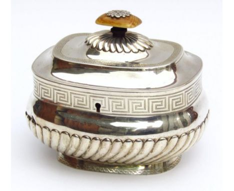 A George III silver tea caddy, by Robert & Samuel Hennell, the oblong bombe body surmounted by a part gadrooned lid with an o