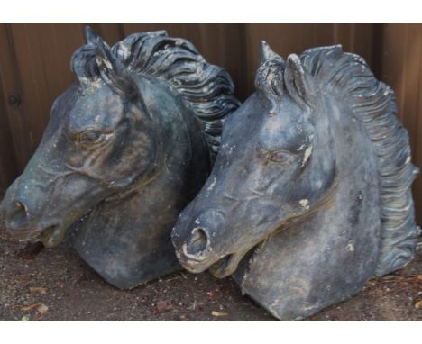 A pair of modern horse head gate finial ornaments, in black, 38cm high.