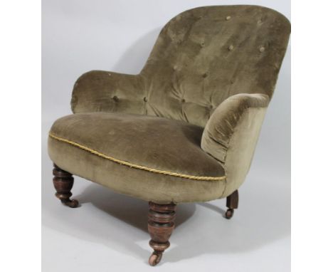 A Victorian mahogany armchair, with green button back arms and seat, on turned tapering legs, with ceramic castors. 