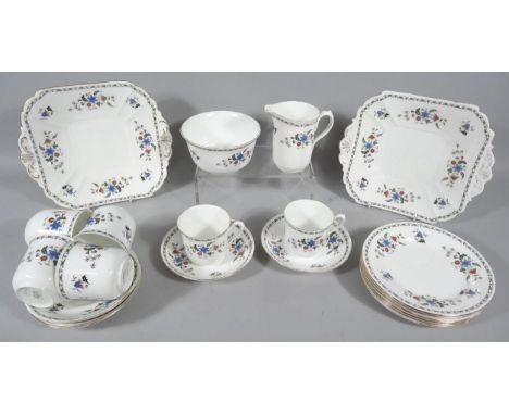 A Shelley part tea service D11280, of floral decoration predominantly in blue, green and black on a white ground, to include 