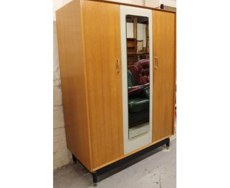 A 1960's G Plan light oak double wardrobe.
