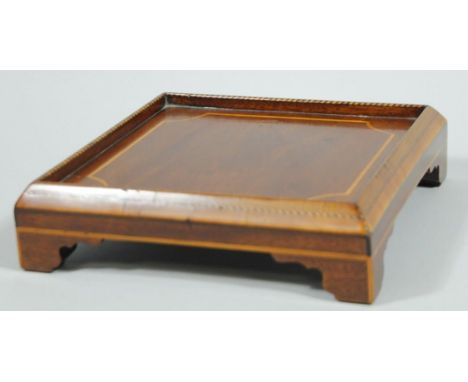 A late 19thC mahogany and boxwood sprung Sheraton Revival teapot stand, of narrow galleried square outline, with an inlaid ce