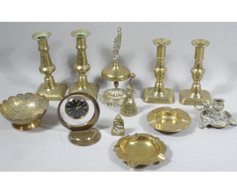 Various brassware, to include an elaborate porter's bell with cockerel finial, on shaped rococo base, 21cm high, four candles