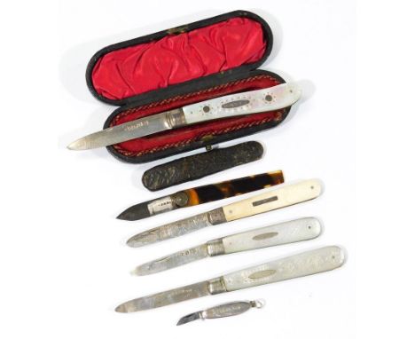 A Victorian silver folding fruit knife, the shaped handle set with flowers and engraved to the cartouche, EG KIBA, with plain