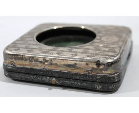 An Edwardian silver pocket watch case, of rounded outline with central opening and velvet back, the body decorated with an ar