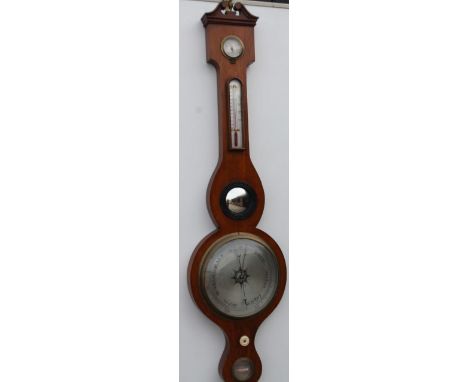 A late 19thC wheel barometer, by Negertti and Zambra, London, in an oak case, with dry damp gauge, thermometer, convex mirror