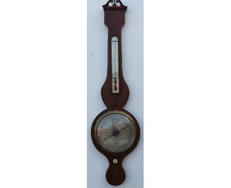A mid 19thC mahogany wheel barometer, by J Sordellie, London, the boxwood and ebony strung case, with thermometer, silvered d
