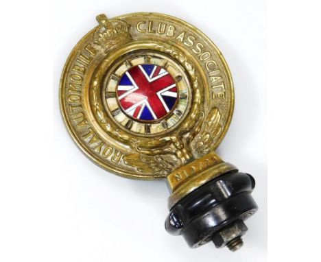 A mid 20thC part brass Royal Automobile Club Association car mascot, centred with Union Jack flag in typical colours with mou