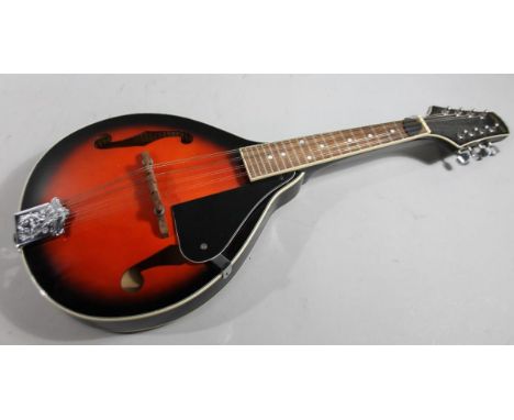 A modern eight string Stagg mandolin model M20 1006/25, with shaped body, articulated tuning knops, and with interior label, 