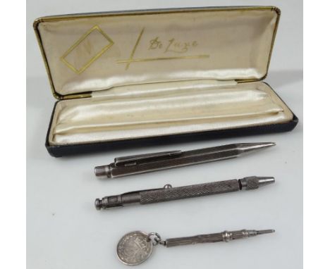 A late 19thC propelling pencil, of small proportion, 6cm wide, unmarked, attached to a Victorian 1887 3d bit, an engine turne
