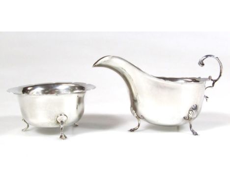 A matched two piece silver tea service, comprising sugar bowl, with flared rim on triple inverted hoof supports, Birmingham 1