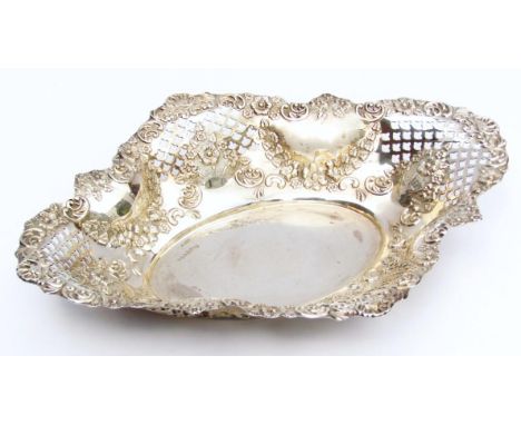 A Victorian silver serving basket, of ellipse outline, partially pierced with a scroll, shell and flower head border and plai