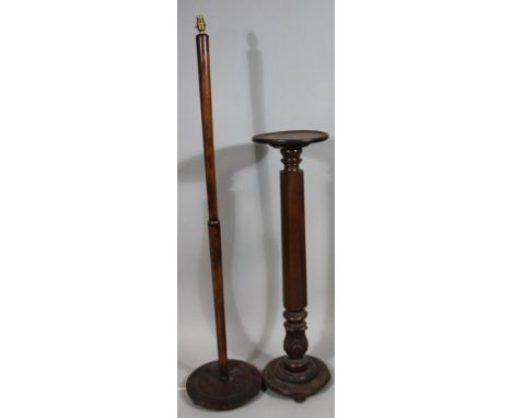 A collection of furniture, to include an oak torchere with octagonal partly carved column, a turned beech standard lamp. (2).