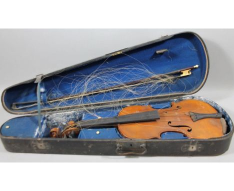 An early 20thC Berlin copy violin, with one piece back, Stradivarius label, and ebonised mounts, 59cm wide, (the main body), 