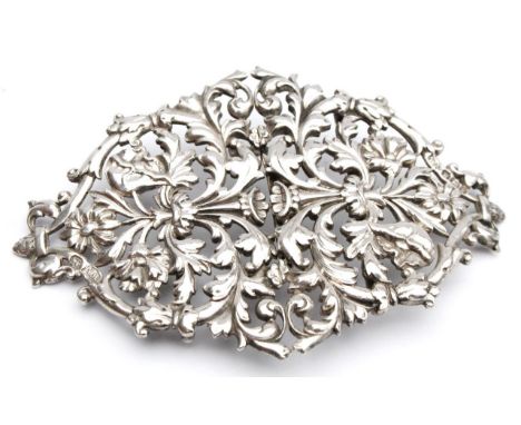 A Victorian silver double buckle, of elaborate diamond shaped outline, heavily set and cast with scrolls and flower heads sep