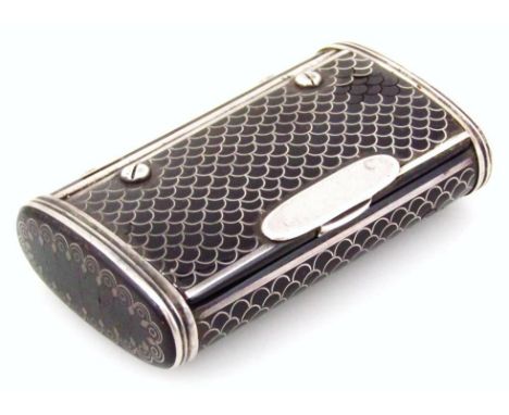 An elaborate late 19thC snuff box, of rounded outline with repeat filigree style wirework decoration on a black ground, with 