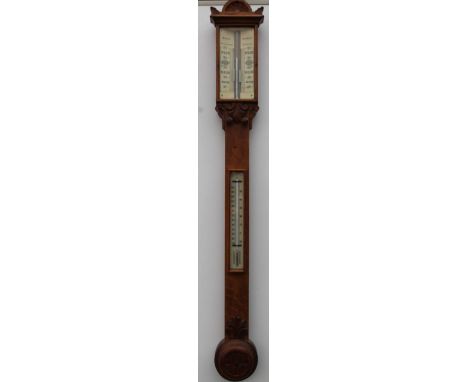 A Victorian oak stick barometer, by Mason of Barnsley, with ivorine register and thermometer, turned cistern cover carved wit