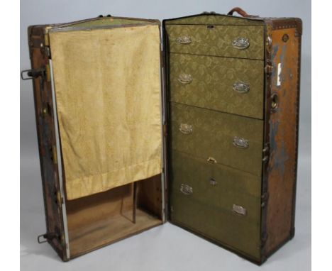 An early 20thC metal bound travel wardrobe trunk by L. McBrine Co. Ltd, (AF) 103cm wide, 56cm deep, 55cm high.