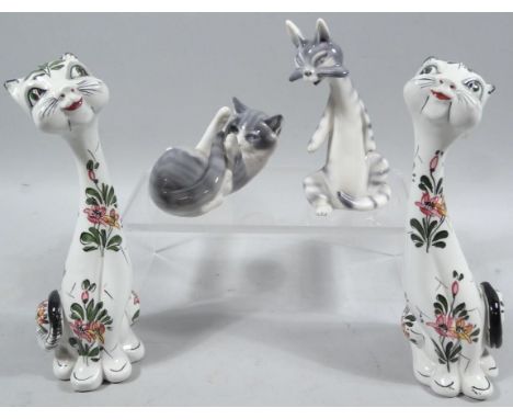 A 20thC Royal Copenhagen porcelain figure of a recumbent kitten, no 727, printed marks beneath, 10cm wide, a Goebel Hummel fi