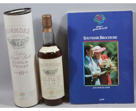 A bottle of Bowmore ten year Old Islay single malt scotch whisky, from The Glasgow Garden Festival 1988, in cylindrical tube,
