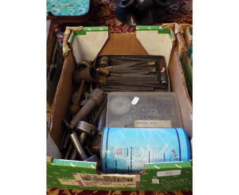 A box containing a selection of assorted dies and screw cutting tools