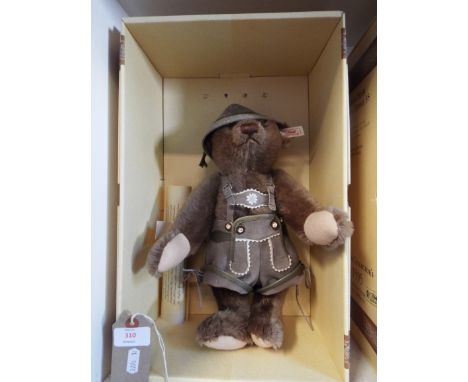 A boxed Steiff limited edition 891 of 1500 'Austria Bear', in grey mohair with leather lederhosen complete with certificate  