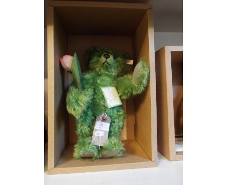 A boxed limited edition Steiff 1243 of 1847 'Holland Bear 1997', in green mohair with tulip complete with tag and certificate