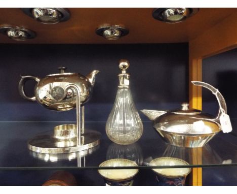 A good quality Art Deco style silver plated teapot together with a spirit kettle and decanter of pear form