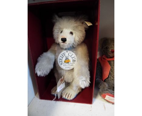 A boxed Steiff limited edition 'Teddy Baby Bear 1929', in grey mohair and blue pads together with porcelain medallion, no cer