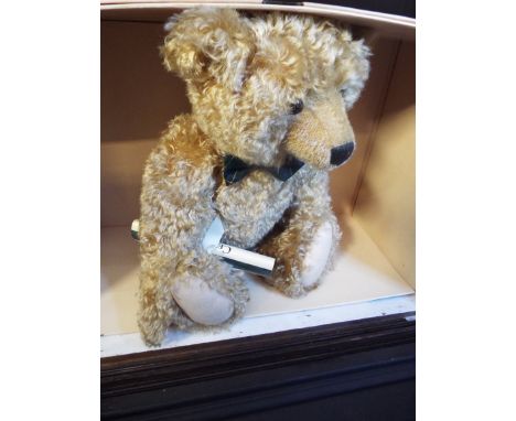 A boxed Steiff limited edition 273 of 2000 'Henderson 55' growler teddy bear in blonde mohair and jointed limbs produced excl