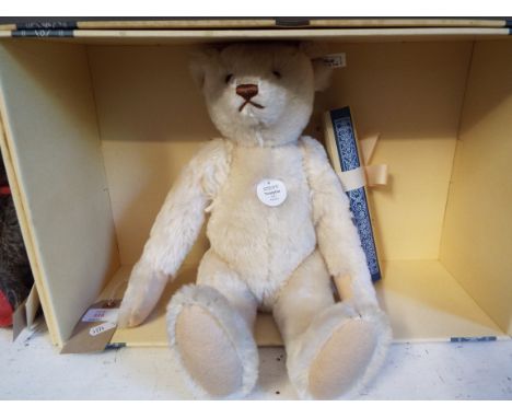 A boxed Steiff limited edition 709 of 4000 'Teddy Bear 1921' in white mohair complete with tag and certificate