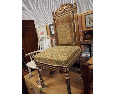 A floral carved gilt framed side chair with tapestry upholstered back and seat, raised on fluted supports