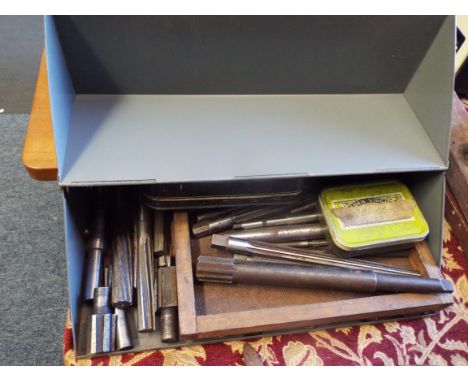 A box of assorted metal working reamer cutting tools of various sizes 