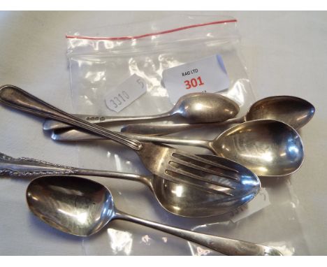 Five silver teaspoons and a fork