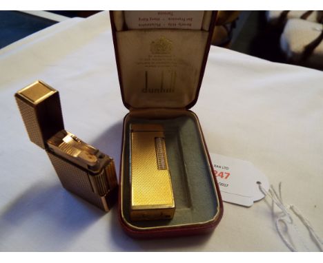 A gold plated S.T. Dupont 20u Paris hobnail cut glass lighter No.DY1955, together with a gold plated Dunhill roller gas light