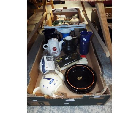 A selection of advertising items to include ceramic whisky water jugs, a Tetley clock and rugby ball, Milkybar watercolours, 
