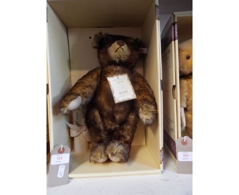 A boxed Steiff limited edition 1153 of 3000 'Brown Tipped', teddy bear in speckled brown mohair complete with tags and certif