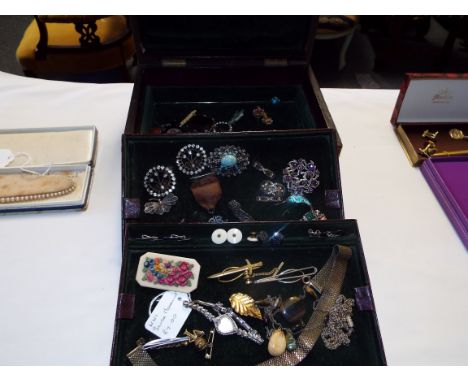 A Victorian leather covered three-tier jewellery box with a quantity of vintage and antique jewellery to include large Scotti