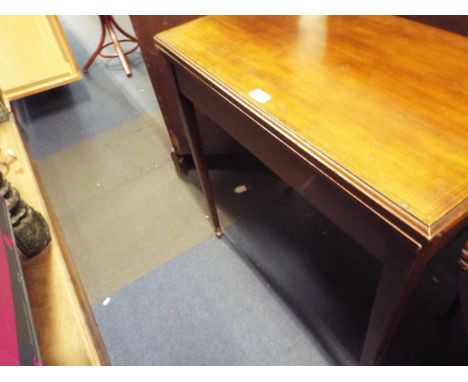 A Victorian boxwood and ebony strung folding card table raised on square tapering supports and ceramic castors 