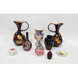 Pair of Bretby Art pottery vases of bulbous whiplash form, decorated with birds perched amongst