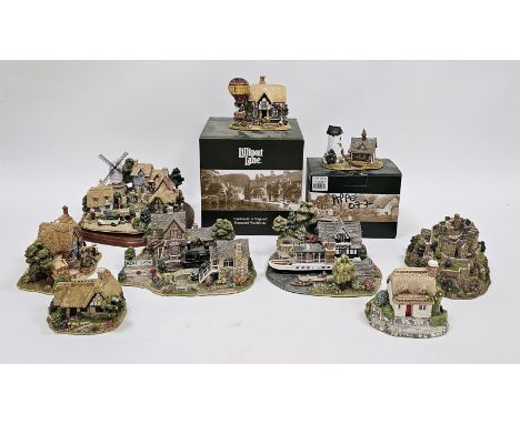Collection of Lilliput Lane models of houses, castles and villages, including Britain's Heritage, Village Green on wooden sta