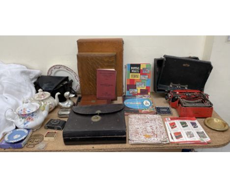 A leather writing slope and letters, together with a  typewriter, leather case, stamps, teapot, crown, camera etc