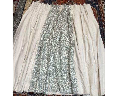 A pair of cream linen with a patterned leading edge curtains, lined and interlined, approximately 160 x 212cm