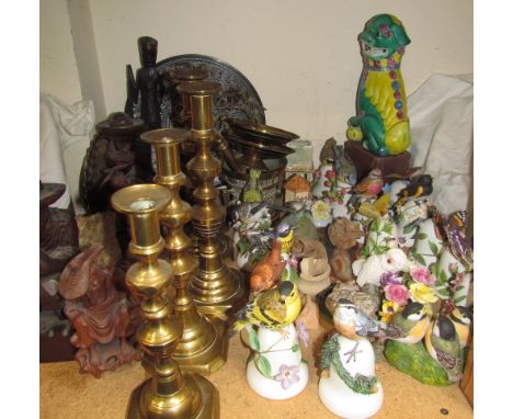 A collection of Franklin Mint porcelain bells with bird and butterfly mounts, brass candlesticks, carved figures etc