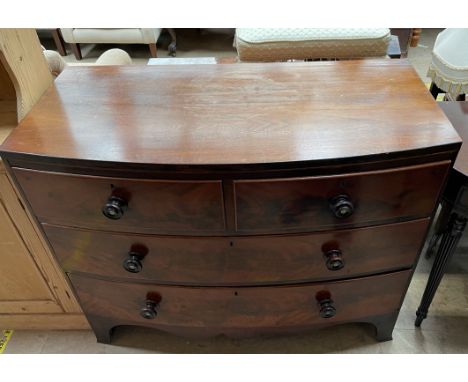 A George III mahogany chest, the 'D' shaped top above two short and two long drawers on bracket feet