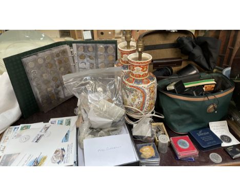 A collection of world coins, together with stamps, Pentax camera, other cameras and lenses, pottery lamps etc